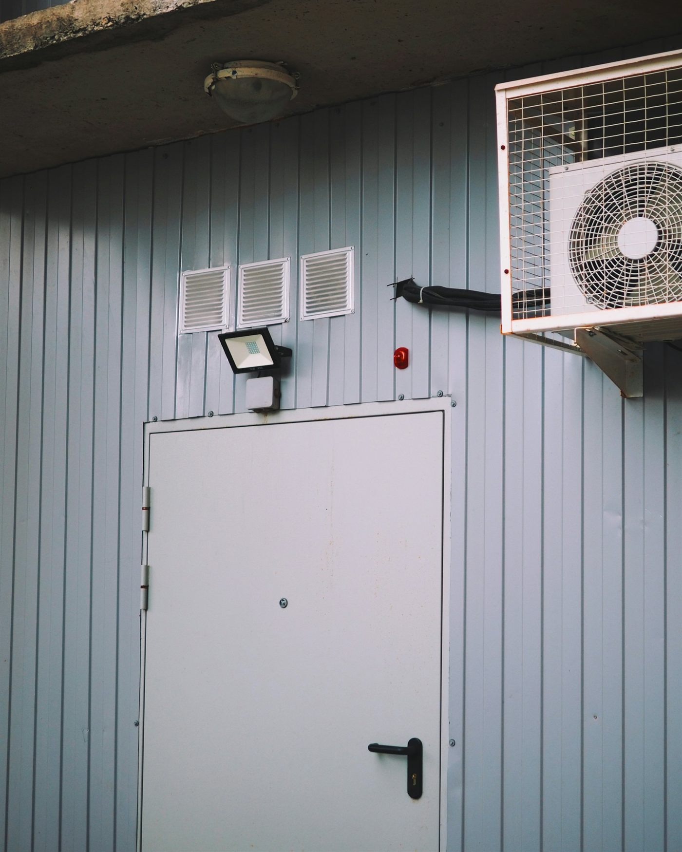 Wall-mounted ductless mini-split style air conditioning unit
